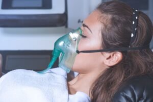 oxygen mask woman needed oxygen