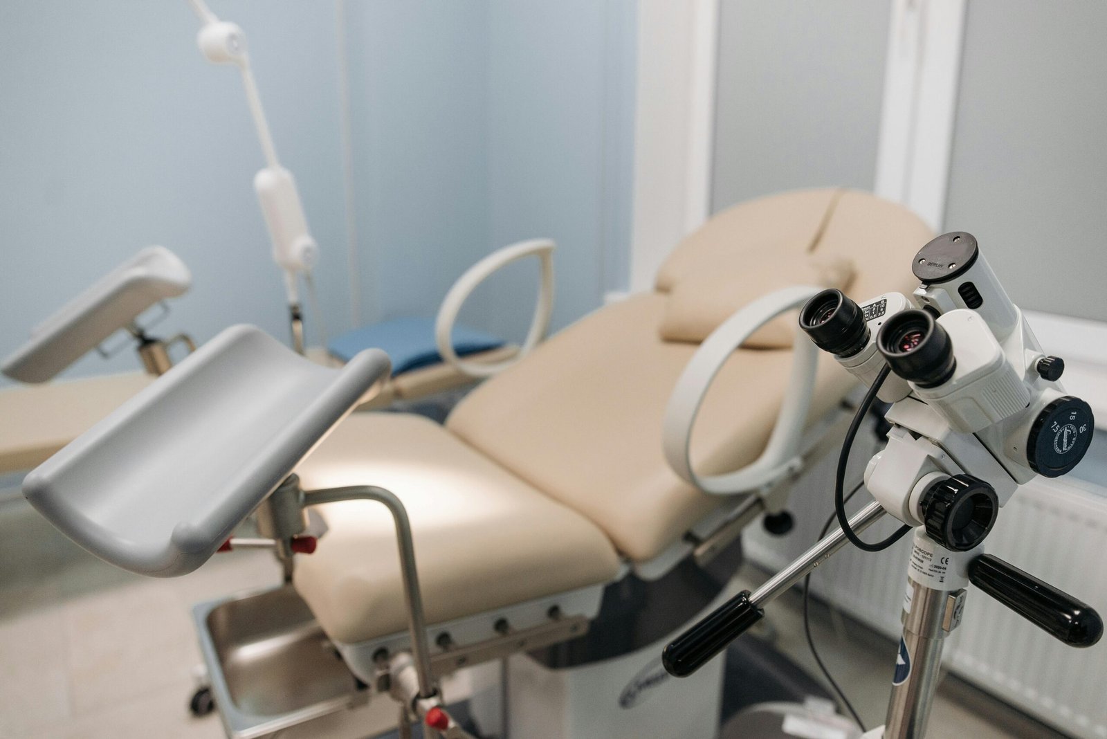 Products A sterile and well-equipped medical examination room with a focus on precision instruments.